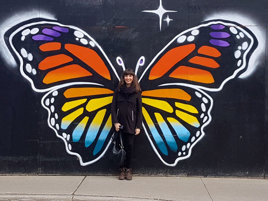 Kristin posing with street art in Ottawa