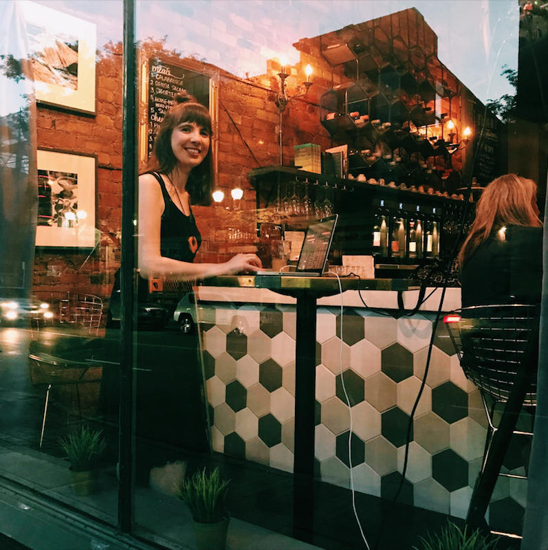 Kristin DJing Toast Wine Bar. Photo by Julie Fazooli.